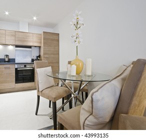 Modern Kitchen With Round Glass Top Dining Table Detail
