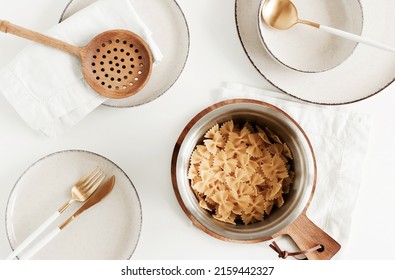 Modern kitchen utensils and pasta top view on table.Trendy Eco style home still life.Space for text or menu . Business food brand template. - Shutterstock ID 2159442327