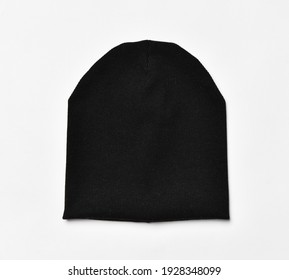 Modern knitted black beanie hat, knitwear isolated on white background