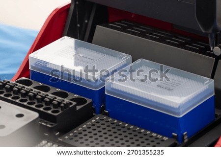 A modern laboratory device with sample containers is used for analysis