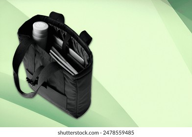 Modern Laptop Bag with Accessories on Green Background - Powered by Shutterstock
