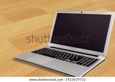 Modern laptop computer with a blank screen on the desk