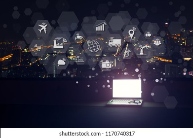 Modern Laptop With Internet Of Things (IOT) Objects Icon Connecting Together Coming Out Monitor, Internet Networking Concept, Connect Global Wireless Devices With Each Other.