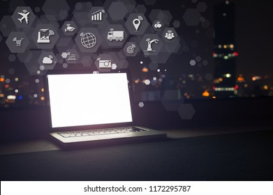 Modern Laptop With Internet Of Things (IOT) Objects Icon Connecting Together Coming Out Monitor, Internet Networking Concept, Connect Global Wireless Devices With Each Other.