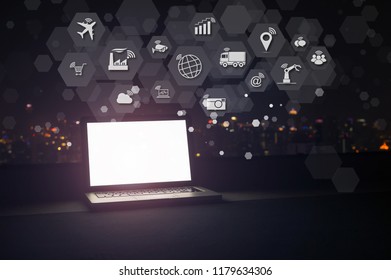 Modern Laptop With Internet Of Things (IOT) Objects Icon Connecting Together Coming Out Monitor, Internet Networking Concept, Connect Global Wireless Devices With Each Other.