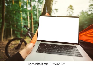 Modern Laptop Mockup. Working Remotely In The Forest With A Bicycle In The Background