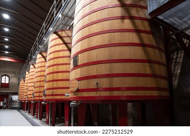 Modern large wooden barrels for wine fermentation process, red and white wine making in La Rioja region, Spain
