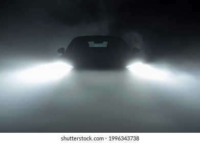 Modern LED Car Headlights in Dense Fog Automotive Industry Theme. Hard Road Driving Conditions. 