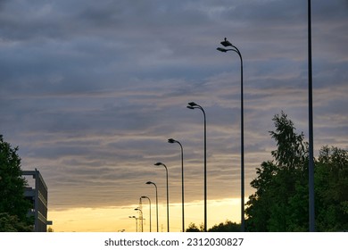 modern LED lamps, city lighting, blue sky in the background, sunset