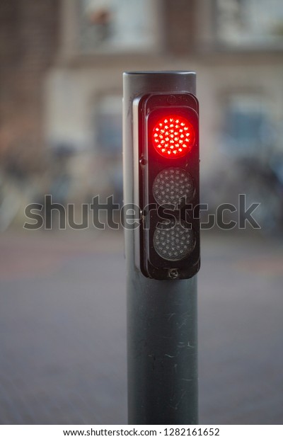 Modern LED traffic lights with red stop signal,\
close up photo