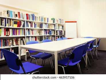 Modern Library Interior With Blue Chairs