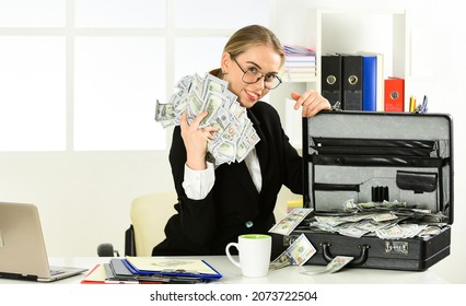modern life and business. corporate leather bag. sexy woman with case at workstation. happiness and success. Businesswoman holding briefcase. suitcase with money. good deal