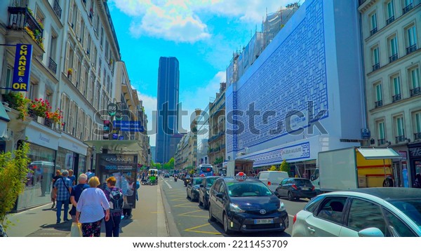Modern life of people. Tourists. Shopping.\
Pishehody. Car traffic in the Romantic City Museum. Architecture.\
City streets in France Paris\
09.2022