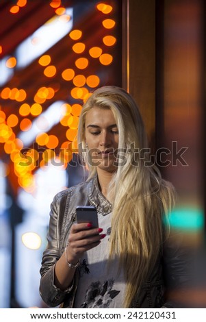 Modern lifestyle. Young woman  using the  smart phone