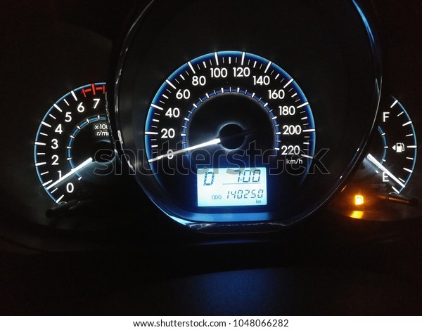 Modern light car mileage (dashboard, milage)\
isolated on a black background. New display of a modern car. Avg\
fuel econ, Avr speed.