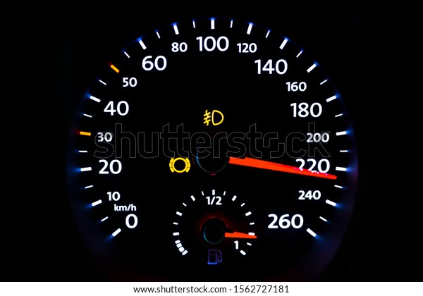 Modern\
light car mileage (dashboard, milage) isolated on a black\
background. New display of a modern car.\
Km/h.