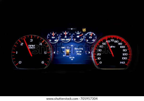 Modern\
light car mileage (dashboard, milage) isolated on a black\
background. New display of a modern car. Oil\
life.