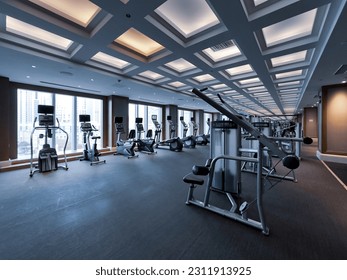 Modern light gym. Sports equipment in gym. Barbells of different weight on rack. - Powered by Shutterstock