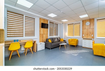 Modern Light Ward Of Maternity Hospital. Empty Sofa And Armchair In A Emergency Room. Full Length View