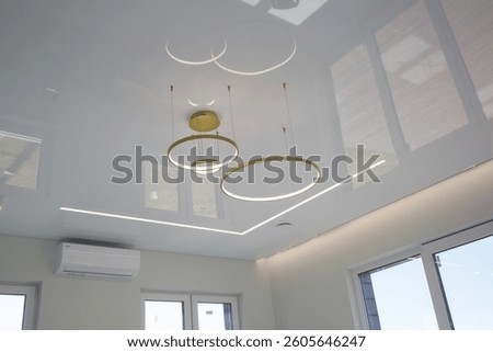 Modern lighting in the interior with a stretch ceiling