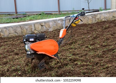 Modern Lightweight Tiller On Cultivated Soil Stock Photo 1168838002 