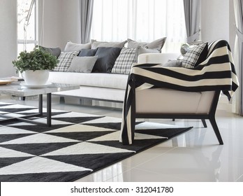 Modern Living Room Interior With Black And White Checked Pattern Pillows And Carpet