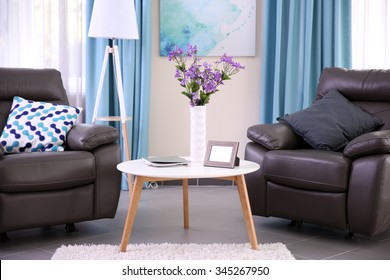 Modern living room interior with coffee table, armchairs and stand - Shutterstock ID 345267950