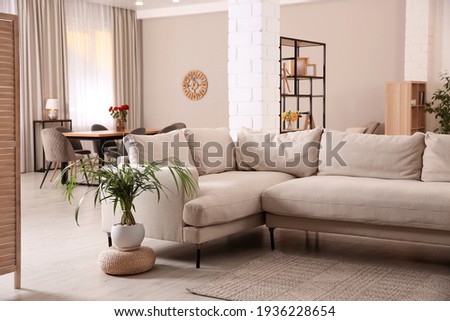 Modern living room interior with comfortable sofa and wooden table