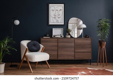 Modern living room interior composition with fluffy armchair, wooden commode, mock up poster frame, vinyl recorder and modern home accessories. Blue wall. Template. Copy space. - Shutterstock ID 2109724757
