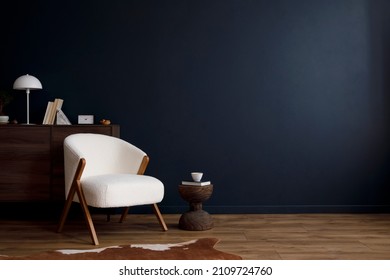Modern living room interior composition with fluffy armchair, wooden commode and modern home accessories. Blue wall. Template. Copy space. Home staging. - Shutterstock ID 2109724760