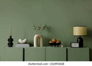 Modern living room interior composition with modern home decorations and personal accessories on the eucalyptus wooden commode. Eucalyptus wall. Template. Copy space. - Shutterstock ID 2124955028