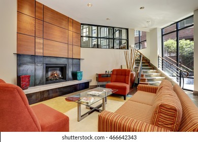 Modern Living Room Interior Design In Red And Orange Colors With Fireplace. Northwest, USA