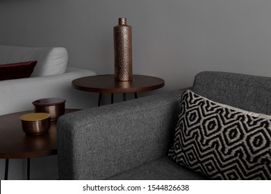 Modern Living Room With Linen Sofa And Dark Gray Armchair. Wooden Side Tables And Sober Decoration Objects.