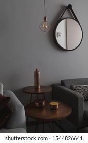 Modern Living Room With Linen Sofa And Dark Gray Armchair. Wooden Side Tables And Sober Decoration Objects.