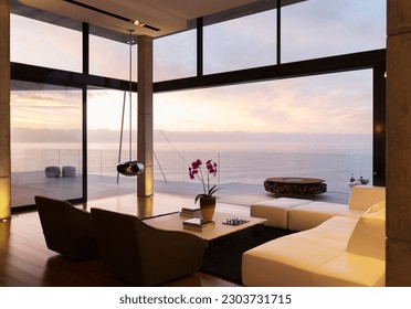Modern living room overlooking ocean - Shutterstock ID 2303731715