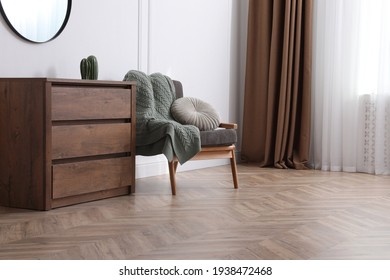Modern living room with parquet flooring and stylish furniture - Shutterstock ID 1938472468