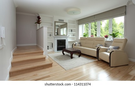 Modern Living Room With Staircase And Fireplace