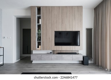 Modern living-room with wall and built in TV - Shutterstock ID 2246841477