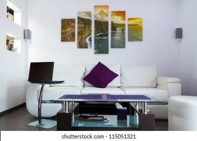 Modern lliving room interior with Cliffs of Moher canvas on the wall