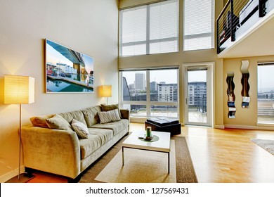 Modern Loft Apartment Living Room Interior With High Ceiling.