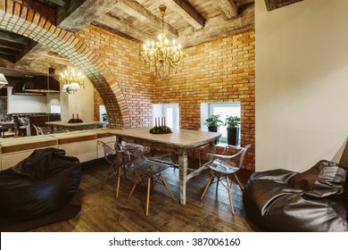 Modern Loft Cafe With Brick Wall Interior Design. Vintage Luxury Style Decor