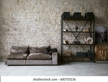Modern loft living room with high ceiling, empty brown brick wall, concrete floor, design accessories in the steel stack. Mock up interior photo