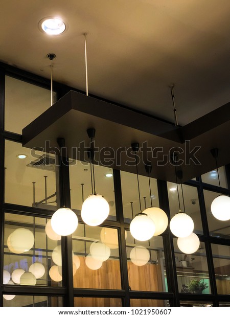 Modern loft style pendant/ ceiling lamp. Light\
and shadow. Interior\
concept.