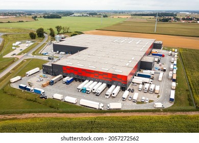 modern logistics center and many trucks awaiting unloading. Warehouses of mail and online stores