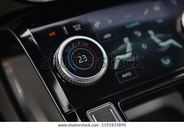 Modern looking climate control unit in\
the new luxury car and automatic gearbox\
buttons.