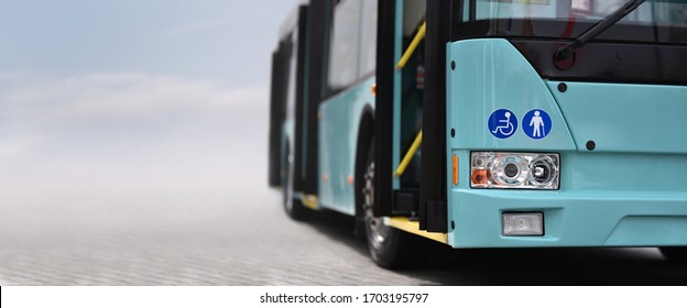 Modern Low Floor City Bus With Open Doors On Sky Background