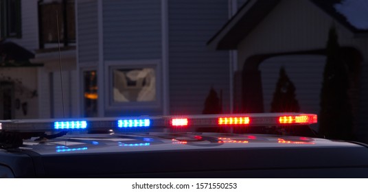 A Modern, Low Profile, Overhead Police Light Bar Flashing.