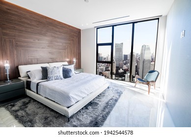 Modern and luxurious bedroom with white ceiling and wood accents with views of Tokyo skyline, particularly Minato ward. Condo or Hotel accomodation. - Shutterstock ID 1942544578