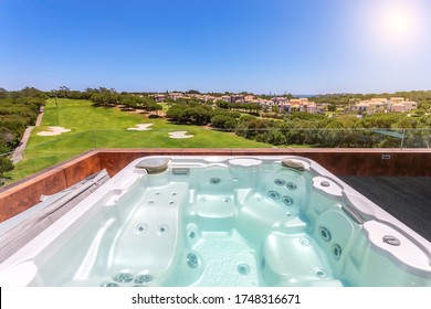 Modern luxurious pool with hydromassage, with beautiful views and greenery.