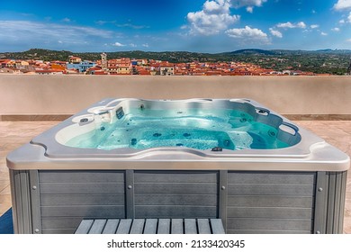 Modern luxurious pool with hydromassage overlooking the town of Santa Teresa Gallura, located on the northern tip of Sardinia in the province of Sassari, Italy